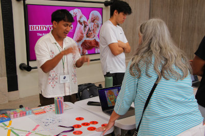 Aryan Tamrakar presenting at Family
              Day, Bridges 2024