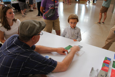 Young attendee learning about
              Gnomon at Bridges 2024